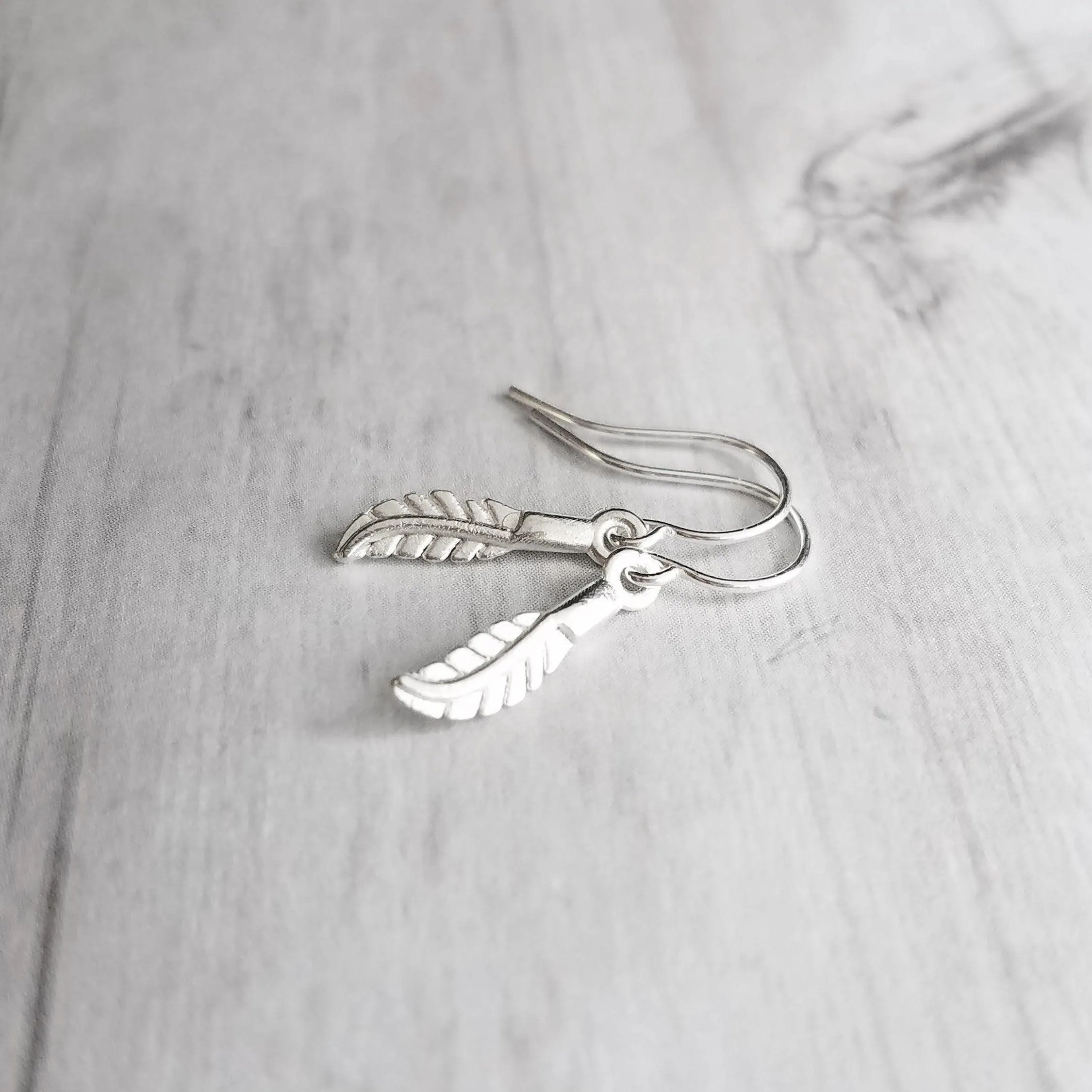 Silver Feather Earrings, .925 sterling silver hooks. tiny feather charm, small feather dangle, minimalist silver earring, simple feather, birthday anniversay gift