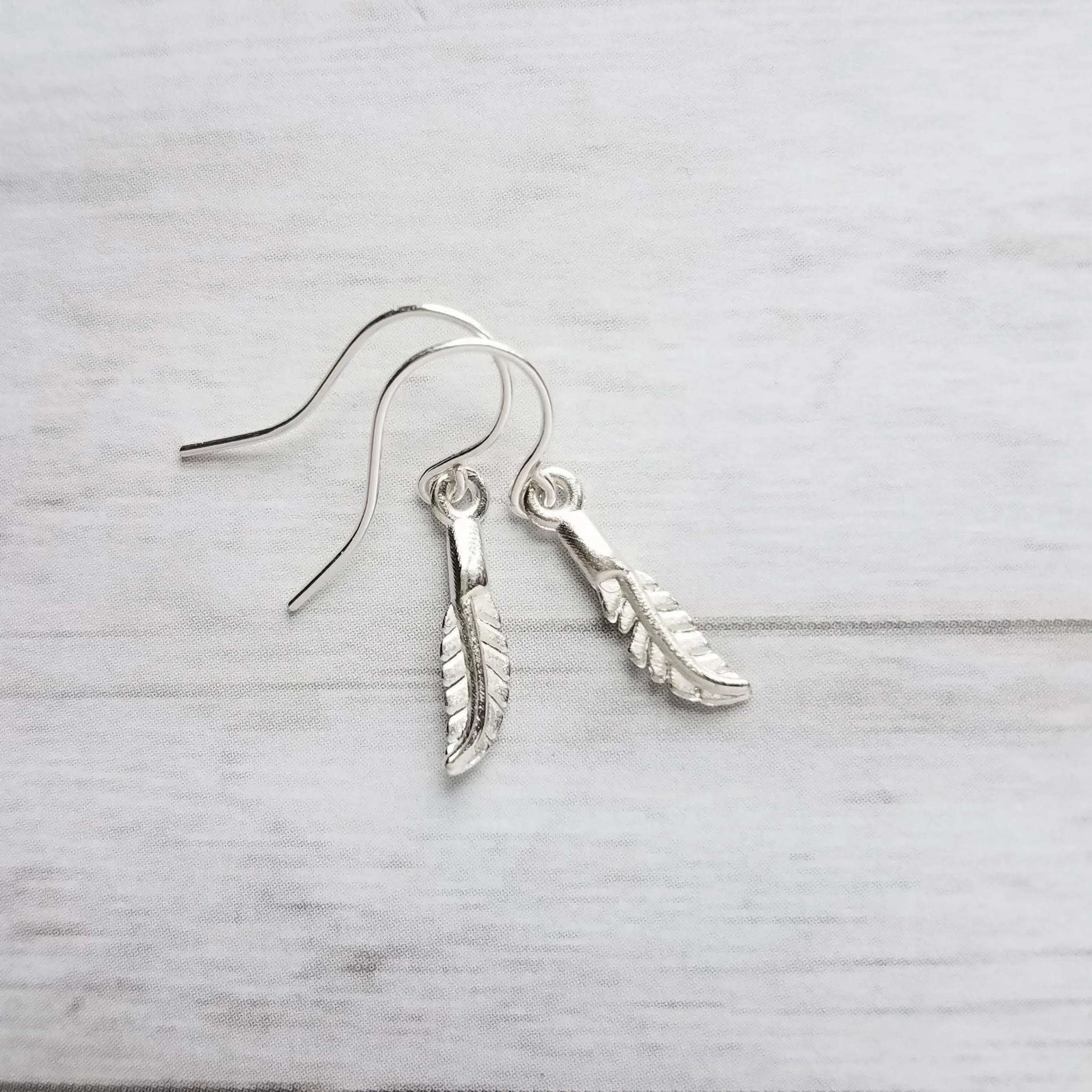 Silver Feather Earrings, .925 sterling silver hooks. tiny feather charm, small feather dangle, minimalist silver earring, simple feather, birthday anniversay gift