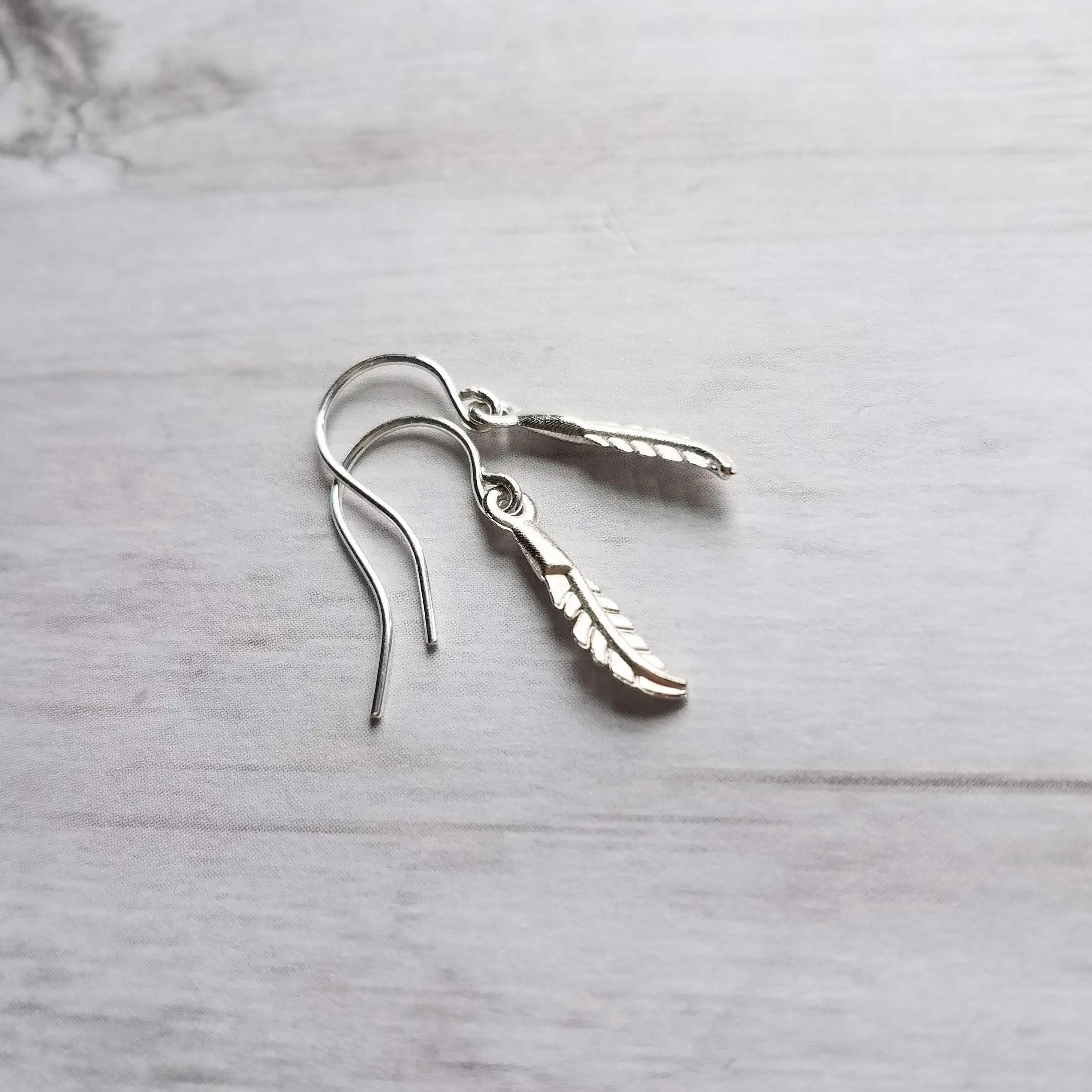 Silver Feather Earrings, .925 sterling silver hooks. tiny feather charm, small feather dangle, minimalist silver earring, simple feather, birthday anniversay gift
